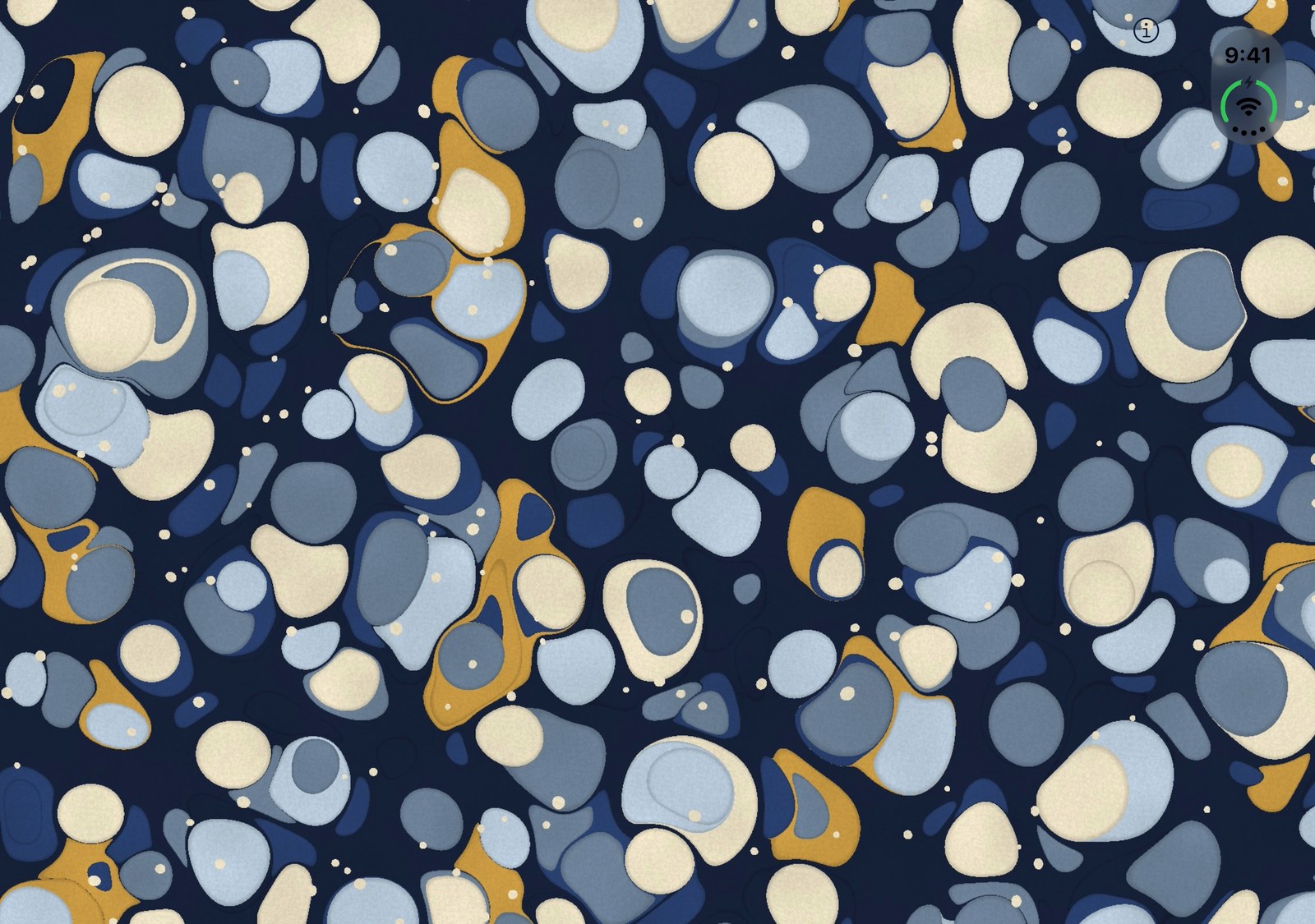 The open phone filled edge to edge with a stone-marbled endpaper: blue, slate, cream and ochre spots on blue-black